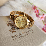 Burberry The Classic Champagne Gold Dial Gold Steel Strap Watch for Women - BU10109