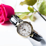 Tissot Flamingo Mother of Pearl White Dial Black Leather Strap Watch For Women - T094.210.26.111.00